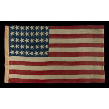 40 CANTED STARS IN AN ORDERLY PHALANX, ON AN ANTIQUE AMERICAN FLAG WITH A RARE STAR COUNT, ACCURATE FOR JUST SIX DAYS AND NEVER OFFICIAL, REFLECTING SOUTH DAKOTA’S ADMISSION TO THE UNION