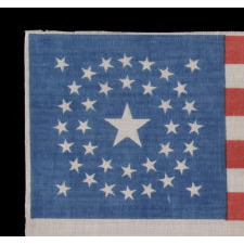 37 STAR ANTIQUE AMERICAN FLAG WITH A DOUBLE-WREATH CONFIGURATION, PROBABLY MADE FOR THE CELEBRATION OF THE CENTENNIAL OF AMERICAN INDEPENDENCE IN 1876, REFLECTS THE TIME DURING WHICH NEBRASKA WAS THE MOST RECENT STATE TO JOIN THE UNION