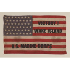 48 STAR VINTAGE AMERICAN FLAG WITH "VICTORY AT WAKE ISLAND" AND "U.S. MARINE CORPS" OVERPRINTS, MADE TO CELEBRATE THE TRIUMPHANT DEFENSE OF THIS REMOTE AMERICAN BASE AGAINST REPEATED JAPANESE ATTACKS IN 1941, AT THE OUTSET OF WWII