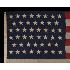 46 STARS ON AN ANTIQUE AMERICAN FLAG, SIGNED BY THE MAKER, M.G. COPELAND OF WASHINGTON, D.C., 1907-1912, OKLAHOMA STATEHOOD