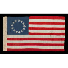 13 HAND-EMBROIDERED STARS AND EXPERTLY HAND-SEWN STRIPES ON AN ANTIQUE AMERICAN FLAG MADE IN PHILADELPHIA BY SARAH M. WILSON, GREAT-GRANDDAUGHTER OF BETSY ROSS, SIGNED & DATED 1908