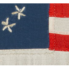 13 HAND-EMBROIDERED STARS AND EXPERTLY HAND-SEWN STRIPES ON AN ANTIQUE AMERICAN FLAG MADE IN PHILADELPHIA BY SARAH M. WILSON, GREAT-GRANDDAUGHTER OF BETSY ROSS, SIGNED & DATED 1908
