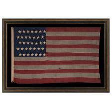 35 STAR ANTIQUE AMERICAN FLAG OF THE CIVIL WAR PERIOD, IN A DESIRABLE SMALL SCALE AMONG ITS COUNTERPARTS, REFLECTS THE TIME DURING WHICH WEST VIRGINIA WAS THE MOST RECENT STATE TO JOIN THE UNION, 1863-1865