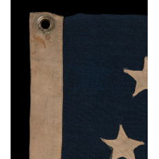 35 STAR ANTIQUE AMERICAN FLAG OF THE CIVIL WAR PERIOD, IN A DESIRABLE SMALL SCALE AMONG ITS COUNTERPARTS, REFLECTS THE TIME DURING WHICH WEST VIRGINIA WAS THE MOST RECENT STATE TO JOIN THE UNION, 1863-1865