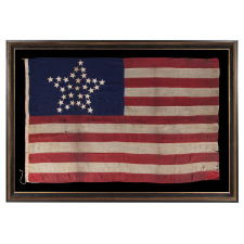 SPECTACULAR ANTIQUE AMERICAN FLAG WITH 31 STARS ARRANGED IN THE "GREAT STAR" PATTERN; ITS CANTON RESTING THE WAR STRIPE, 1850- 1858, CALIFORNIA STATEHOOD