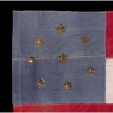 FIRST NATIONAL PATTERN CONFEDERATE FLAG WITH 8 METALLIC BULLION STARS, GOLD ON THE OBVERSE AND SILVER ON THE REVERSE, AN EARLY REUNION ERA EXAMPLE, MADE CA 1884-1910; THE STAR COUNT REFLECTING VIRGINIA’S SECESSION IN APRIL / MAY OF 1861