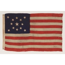 13 STARS IN A MEDALLION CONFIGURATION ON A SMALL-SCALE ANTIQUE AMERICAN FLAG OF THE 1895-1926 ERA
