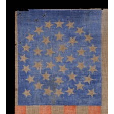 38 STAR FLAG WITH A TRIPLE-WREATH CONFIGURATION AND 2 OUTLIERS, ON AN ANTIQUE AMERICAN PARADE FLAG WITH RICH, CORNFLOWER BLUE COLORATION AND ENDEARING WEAR, 1876-1889, COLORADO STATEHOOD