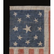 13 STARS IN A MEDALLION PATTERN ON AN ANTIQUE AMERICAN PARADE FLAG, MADE FOR THE 1876 CENTENNIAL OF AMERICAN INDEPENDENCE; A SCARCE EXAMPLE AMONG ITS COUNTERPARTS, WITH NICE FOLK QUALITIES
