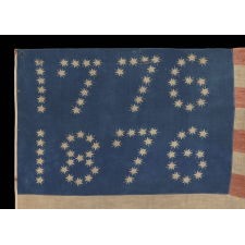 ANTIQUE AMERICAN FLAG WITH 10-POINTED STARS THAT SPELL “1776 – 1876”, MADE FOR THE 100-YEAR ANNIVERSARY OF AMERICAN INDEPENDENCE, ONE OF THE MOST GRAPHIC OF ALL EARLY EXAMPLES
