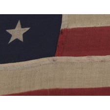 38 STARS IN A NOTCHED, CROSSHATCH PATTERN ON AN ANTIQUE AMERICAN FLAG MADE BY THE U.S. BUNTING COMPANY IN LOWELL, MASSACHUSETTS, 1876-1889, COLORADO STATEHOOD