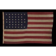 38 STARS IN A NOTCHED, CROSSHATCH PATTERN ON AN ANTIQUE AMERICAN FLAG MADE BY THE U.S. BUNTING COMPANY IN LOWELL, MASSACHUSETTS, 1876-1889, COLORADO STATEHOOD