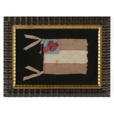 CONFEDERATE 1ST NATIONAL PATTERN BIBLE FLAG WITH A RIBBON IN PLACE OF STARS, ATTRIBUTED TO DANIEL CLANCY OF THE 2ND KENTUCKY INFANTRY, WHO SPENT TIME IN THE UNION MILITARY PRISON AT FORT DONELSON, TENNESSEE AND POSSIBLY AT CINCINNATI, OHIO, AND WAS SUBSEQUENTLY KILLED AT VICKSBURG