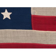38 HAND-SEWN STARS IN AN UNUSUALLY CONFINED PATTERN OF JUSTIFIED ROWS, ON AN ANTIQUE FLAG IN AN ESPECIALLY SMALL SCALE FOR THE PERIOD, 1876-1889, COLORADO STATEHOOD