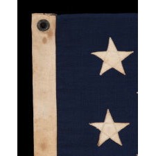 13 STARS ARRANGED IN A 3-2-3-2-3 PATTERN ON A SMALL-SCALE FLAG OF THE 1890'S-1910 ERA, WITH AN ATTRACTIVE, ELONGATED PROFILE