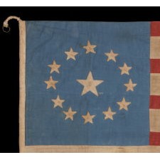 13 STARS IN A CIRCULAR VERSION OF THE 3rd MARYLAND PATTERN, ON A BEAUTIFUL, CORNFLOWER BLUE CANTON, WITH A LARGE CENTER STAR, ON AN ANTIQUE AMERICAN FLAG WITH A SQUARE PROFILE, MADE BETWEEN THE CIVIL WAR (1861-65) AND THE 1876 CENTENNIAL OF AMERICAN INDEPENDENCE