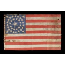 36 STARS IN A MEDALLION CONFIGURATION ON A PARADE FLAG WITH A HUGE, HALOED CENTER STAR; A RARE EXAMPLE, LARGE IN SCALE, CIVIL WAR ERA, NEVADA STATEHOOD, 1864-67