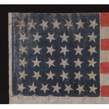 38 STAR ANTIQUE AMERICAN FLAG WITH SCATTERED STAR POSITIONING MADE DURING THE PERIOD WHEN COLORADO WAS THE MOST RECENT STATE ADDED TO THE UNION, 1876-1889