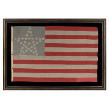 36 STAR ANTIQUE AMERICAN FLAG WITH ITS STARS ARRANGED IN THE "GREAT STAR" PATTERN, ON A DUSTY BLUE CANTON, AND THE FLY END OF THE LAST STRIPE SOUVENIRED; MADE circa 1864-67, CIVIL WAR ERA; POSSIBLY BELONGING TO CAPTAIN H.R. JENNINGS OF THE 21ST CONNECTICUT VOLUNTEER INFANTRY, KILLED AT PETERSBURG