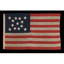 13 STAR ANTIQUE AMERICAN FLAG WITH A BEAUTIFUL MEDALLION CONFIGURATION, A SMALL SCALE EXAMPLE OF THE 1876 CENTENNIAL ERA