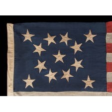 13 STARS IN A BEAUTIFUL MEDALLION CONFIGURATION ON A SMALL SCALE ANTIQUE AMERICAN FLAG MADE DURING THE LAST QUARTER OF THE 19TH CENTURY