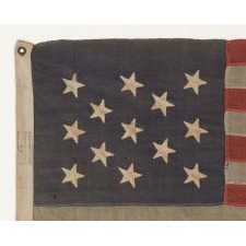 13 STAR FLAG WITH HAND-SEWN, CANTED STARS IN A 3-2-3-2-3 PATTERN, THE ONLY EXAMPLE I HAVE EVER ENCOUNTERED WITH THE MARK OF THE “UNITED STATES LIGHTHOUSE ESTABLISHMENT”, AN EXCEPTIONAL EXAMPLE IN A WONDERFUL SMALL SCALE, MADE ca 1880 - 1895