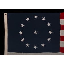 13 STARS IN A CIRCULAR VERSION OF THE 3RD MARYLAND PATTERN, ON AN ESPECIALLY ATTRACTIVE, SMALL SCALE, ANTIQUE AMERICAN FLAG, MADE IN THE 1890's-1910 ERA
