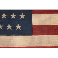 44 STARS IN ZIGZAGGING ROWS ON A PRESS-DYED WOOL AMERICAN FLAG MADE BY THE HORSTMANN COMPANY IN PHILADELPHIA, POSSIBLY FOR USE AS A MILITARY CAMP COLORS, 1890-1896, REFLECTS WYOMING STATEHOOD