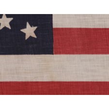 44 STAR ANTIQUE AMERICAN FLAG, MADE CIRCA 1890-1896, WHEN WYOMING WAS THE MOST RECENT STATE TO JOING THE UNION; RARE IN THIS PERIOD WITH A MEDALLION CONFIGURATION OF STARS
