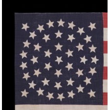 44 STAR ANTIQUE AMERICAN FLAG, MADE CIRCA 1890-1896, WHEN WYOMING WAS THE MOST RECENT STATE TO JOING THE UNION; RARE IN THIS PERIOD WITH A MEDALLION CONFIGURATION OF STARS