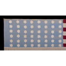 WWII AMERICAN FLAG WITH AN ELONGATED PROFILE, A SKY BLUE CANTON, AND 48 SIX-POINTED STARS WITH STAR-OF-DAVID PROFILES; PROBABLY MADE IN FRANCE OR BELGIUM TO WELCOME U.S. TROOPS FOLLOWING LIBERATION FROM THE GERMANS, CIRCA 1944, AN EXCEPTIONAL EXAMPLE