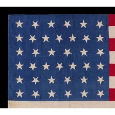 38 STAR FLAG WITH "DANCING" OR "TUMBLING" STARS, MADE OF SILK, WITH GENEROUS SCALE AND VIVID COLORS, COLORADO STATEHOOD, 1876-1889