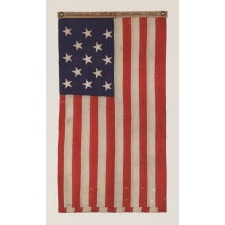 13 STARS IN A 3-2-3-2-3 PATTERN ON A UNITED STATES NAVY SMALL BOAT ENSIGN OF EXCEPTIONALLY SMALL SCALE, MADE AT THE BROOKLYN NAVY YARD, NEW YORK, SIGNED & DATED 1906