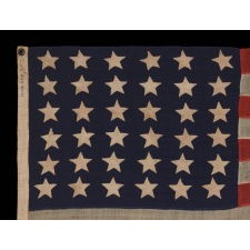 36 STARS ON AN ANTIQUE AMERICAN FLAG OF THE CIVIL WAR ERA, ENTIRELY HAND-SEWN, MADE BY ANNIN IN NEW YORK CITY; DESCENDED IN THE FAMILY OF MAJOR CHARLES HARROD BOYD OF PORTLAND, MAINE, A SURVEYOR ENGINEER FOR BOTH THE U.S. NAVY UNDER COMMODORE DUPONT, AND THE U.S. ARMY UNDER GENERALS J.G. BERNARD, W. L. ELLIOTT, AND GEORGE H. THOMAS; THE STAR COUNT REFLECTS NEVADA STATEHOOD, 1864-67