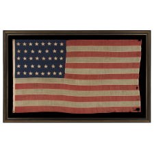 38 HAND-SEWN, SINGLE-APPLIQUÉD STARS ON AN ANTIQUE AMERICAN FLAG MADE AT THE TIME WHEN COLORADO WAS THE MOST RECENT STATE TO JOIN THE UNION, 1876-1889, FORMERLY PART OF THE MASTAI COLLECTION