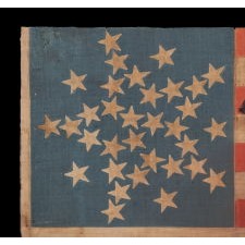 33 STARS IN AN INTERESTING VARIATION OF THE "GREAT STAR" CONFIGURATION, MADE FOR THE 1860 CAMPAIGN OF ABRAHAM LINCOLN & HANNIBAL HAMLIN, WITH WHIMSICAL SERPENTINE TEXT