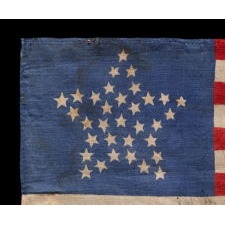 33 STARS IN A “GREAT STAR” PATTERN, ON A SILK ANTIQUE AMERICAN FLAG MADE FOR THE 1864 PRESIDENTIAL CAMPAIGN MADE FOR THE 1864 PRESIDENTIAL CAMPAIGN OF ABRAHAM LINCOLN AND ANDREW JOHNSON, ONE OF THREE KNOWN EXAMPLES IN THIS STYLE