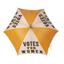 EXTRAORDINARILY RARE, YELLOW & WHITE, SUFFRAGE PARASOL / UMBRELLA, WITH “VOTES FOR WOMEN” TEXT, DISTRIBUTED BY THE NATIONAL AMERICAN WOMEN’S SUFFRAGE ASSOCIATION UNDER ANNA HOWARD SHAW’S LEADERSHIP [HEADQUARTERED IN NEW YORK], CIRCA 1913-1915