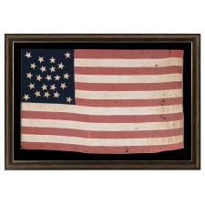22 STAR ANTIQUE AMERICAN FLAG OF THE CIVIL WAR ERA; A SOUTHERN-EXCLUSIONARY COUNT ARRANGED IN A DOUBLE-WREATH MEDALLION CONFIGURATION; HOMEMADE OF WOOL AND COTTON; A RARE STAR COUNT IN ANY PERIOD