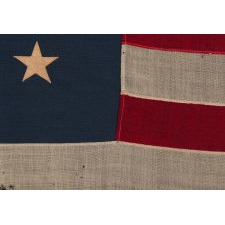 13 STARS IN A MEDALLION CONFIGURATION ON A SMALL-SCALE ANTIQUE AMERICAN FLAG OF THE 1895-1926 ERA, MARKED "STANDARD"
