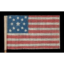 13 STARS IN A MEDALLION PATTERN ON AN ANTIQUE AMERICAN PARADE FLAG MADE FOR THE 1876 CENTENNIAL CELEBRATION; EXHIBITED AT THE MUSEUM OF THE AMERICAN REVOLUTION, JUNE-JULY 2019