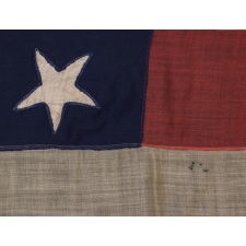 36 SINGLE-APPLIQUÉD STARS ON AN ANTIQUE AMERICAN FLAG MADE IN THE SHOP OF SAILMAKER JOHN DISNEY OF ALBANY, NEW YORK, 9.5 X 14 FEET, CIVIL WAR ERA, NEVADA STATEHOOD, 1864-1867