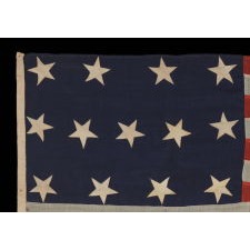 ENTIRELY HAND-SEWN, U.S. NAVY SMALL BOAT ENSIGN OF THE CIVIL WAR PERIOD, WITH 13 STARS IN A 4-5-4 CONFIGURATION, IN THE SMALLEST REGULATION SIZE RECORDED BY THE NAVY DURING THIS GENERAL ERA