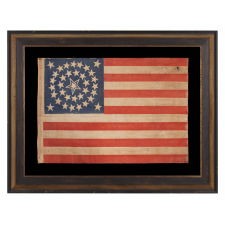 35 STARS IN A MEDALLION CONFIGURATION, ON AN ANTIQUE AMERICAN FLAG OF THE CIVIL WAR PERIOD, WITH A LARGE, HALOED CENTER STAR, 1863-1865, WEST VIRGINIA STATEHOOD