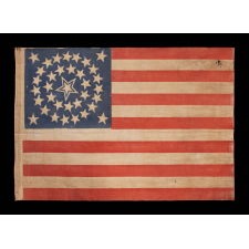 35 STARS IN A MEDALLION CONFIGURATION, ON AN ANTIQUE AMERICAN FLAG OF THE CIVIL WAR PERIOD, WITH A LARGE, HALOED CENTER STAR, 1863-1865, WEST VIRGINIA STATEHOOD