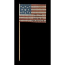 13 STARS ON AN ANTIQUE AMERICAN FLAG MADE FOR USE BY CIVIL WAR VETERANS AT THE 50-YEAR ANNIVERSARY OF THE BATTLE OF GETTYSBURG, WITH A RELATIONSHIP TO THE STORY OF GINNIE WADE