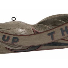 CARVED EAGLE FROM THE SHOP OF JOHN HALEY BELLAMY, UNUSUAL IN GREY PAINT, WITH ELONGATED FORMAT AND HIS TRADITIONAL “DON’T GIVE UP THE SHIP” STREAMER, CIRCA 1890-1905