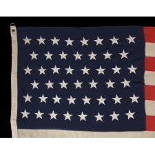 46 STARS ON AN ANTIQUE AMERICAN FLAG OF ESPECIALLY HIGH QUALITY, WITH ORIGINAL REINFORCEMENTS AND HEAVY D-RINGS ON THE HOIST BINDING, 1907-1912, OKLAHOMA STATEHOOD