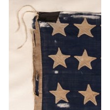 ENTIRELY HAND-SEWN 34 STAR FLAG OF THE CIVIL WAR PERIOD, WITH HAND-SEWN, SINGLE-APPLIQUED STARS AND ENDEARING WEAR FROM LONG-TERM USE, REFLECTS KANSAS STATEHOOD, 1861-1863