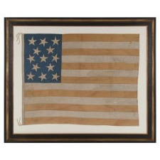 ENTIRELY HAND-SEWN AMERICAN NATIONAL FLAG WITH 13 STARS ON A TALL AND NARROW CANTON; A HOMEMADE EXAMPLE WITH INTERESTING PRESENTATION, MADE SOMETIME BETWEEN THE TAIL END OF THE CIVIL WAR AND THE 1876 CENTENNIAL